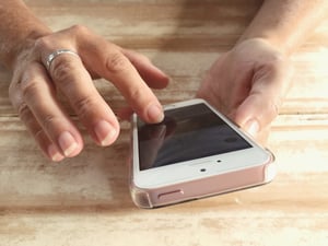 woman-using-smart-phone-selective-focus-finger-o-2025-03-10-04-04-13-utc
